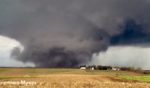 A storm chaser captured one of Friday's huge tornadoes as it tore through farmland near Harlan, Iowa.