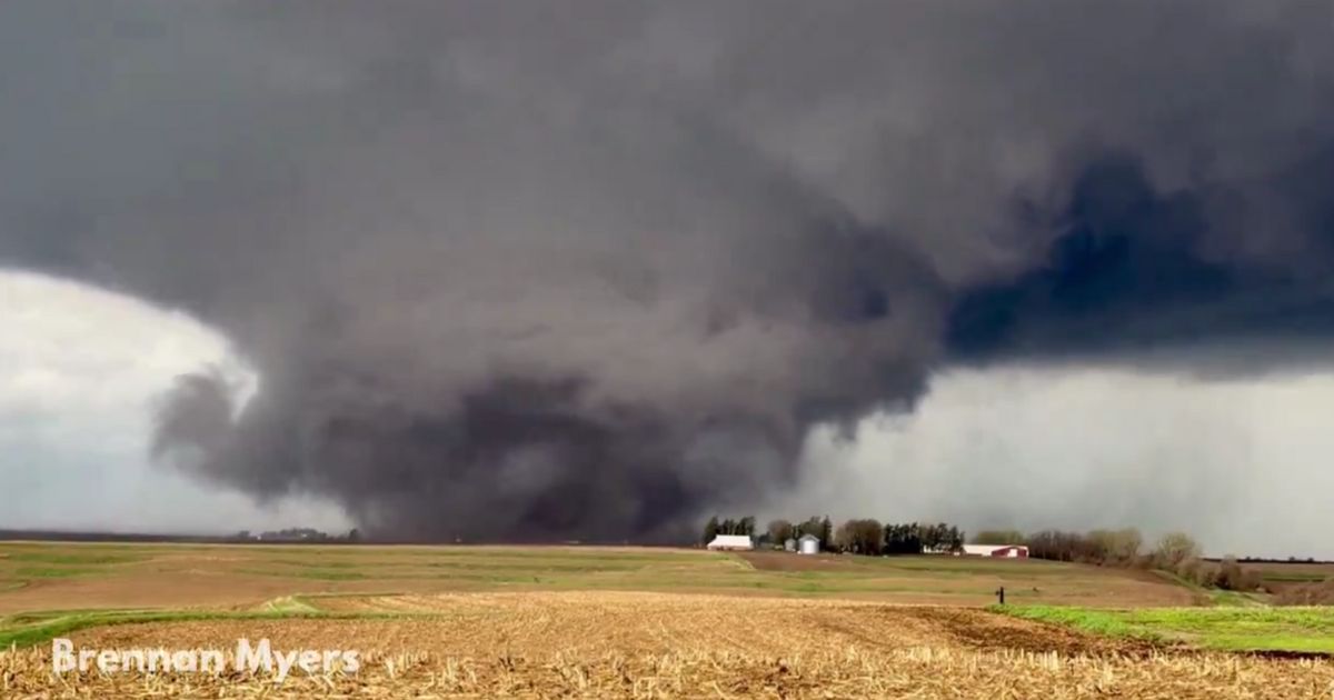 A storm chaser captured one of Friday's huge tornadoes as it tore through farmland near Harlan, Iowa.