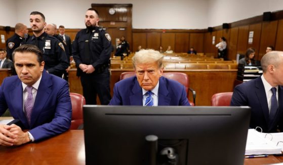 Former President Donald Trump sits in the courtroom alongside attorneys Todd Blanche, left, and Emil Bove, right, during the second day of his criminal trial at Manhattan Criminal Court in New York City on Tuesday.