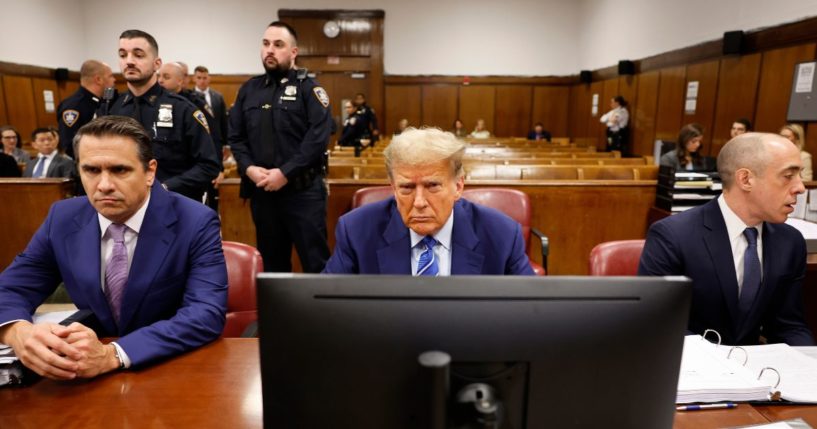 Former President Donald Trump sits in the courtroom alongside attorneys Todd Blanche, left, and Emil Bove, right, during the second day of his criminal trial at Manhattan Criminal Court in New York City on Tuesday.