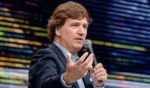 Tucker Carlson speaks during the 10X Growth Conference at the Diplomat Beach Resort in Hollywood, Florida, on April 2.