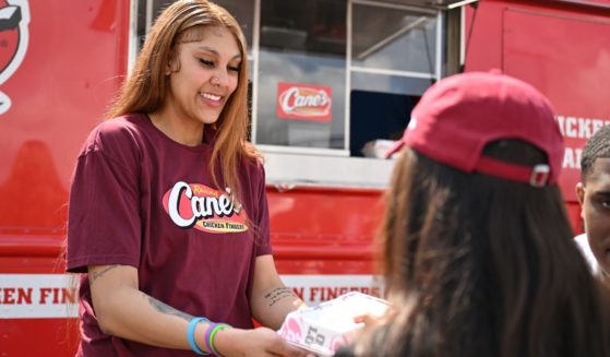 Kamilla Cardoso works with South Carolina women's basketball teammate MiLaysia Fulwiley at a Raising Cane's eatery Wednesday in Columbia, South Carolina.