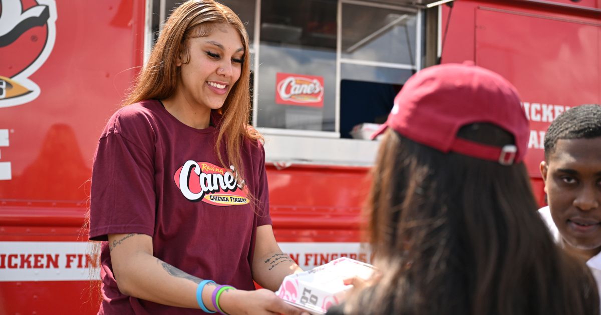 Kamilla Cardoso works with South Carolina women's basketball teammate MiLaysia Fulwiley at a Raising Cane's eatery Wednesday in Columbia, South Carolina.