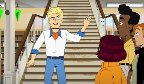 Fred walking down the stairs in the second season of the animated Max show "Velma"