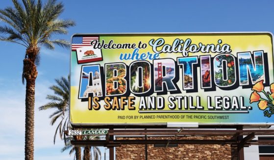 A billboard reads, "Welcome to California where abortion is safe and still legal" on July 12, 2022 in Rancho Mirage, California.