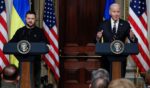 Ukrainian President Volodymyr Zelenskyy and U.S. President Joe Biden hold a news conference in the Indian Treaty Room of the Eisenhower Executive Office Building in Washington on Dec. 12.