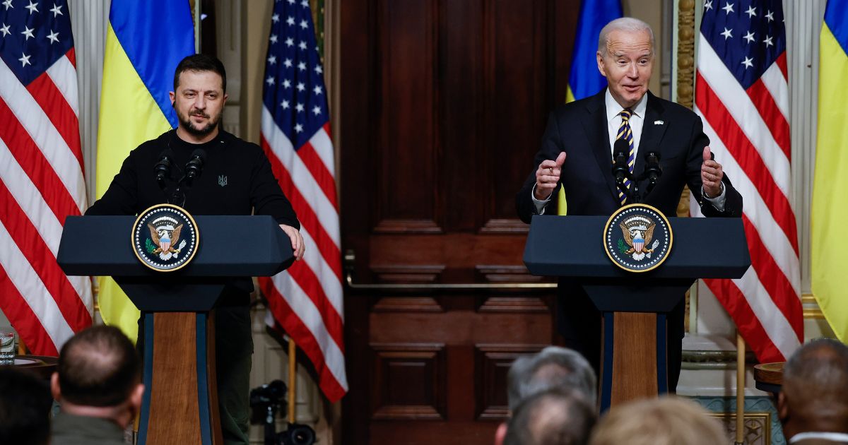 Ukrainian President Volodymyr Zelenskyy and U.S. President Joe Biden hold a news conference in the Indian Treaty Room of the Eisenhower Executive Office Building in Washington on Dec. 12.