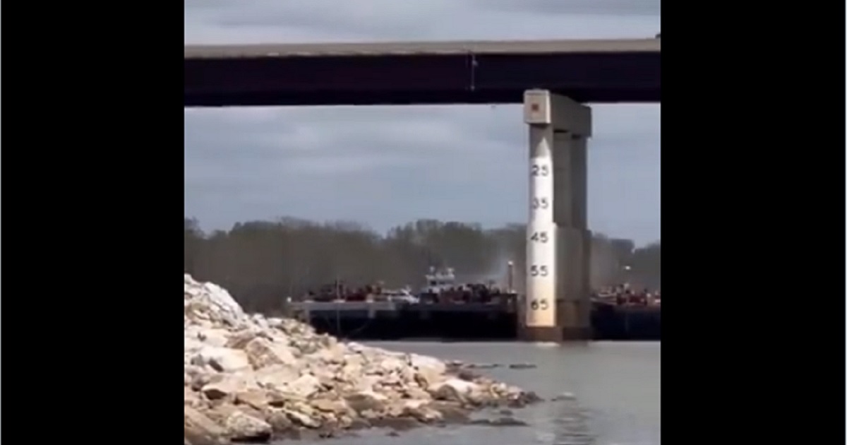 A barge strikes a bridge across the Arkansas River March 30 near Sallislaw, Oklahoma.