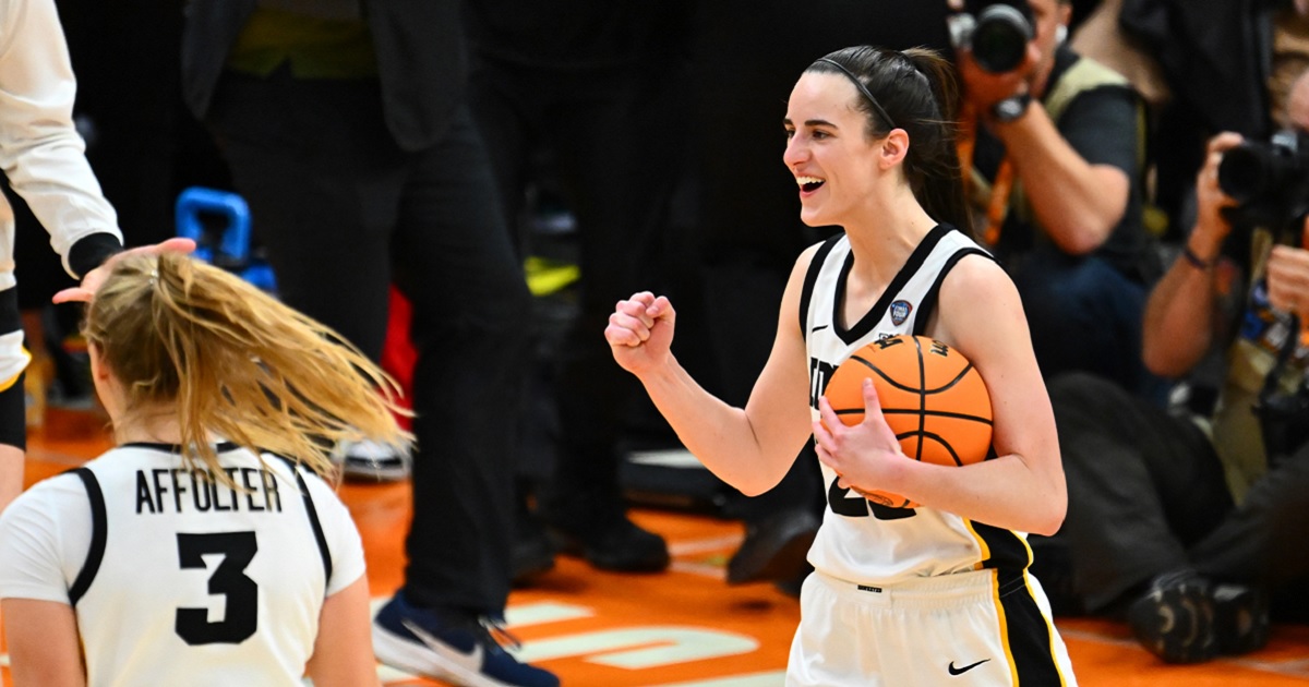 Caitlin Clark of the Iowa Hawkeyes pumps her fist after her team beating the University of Connecticut Huskies during the NCAA Women's Basketball Tournament Final Four semifinal game at Rocket Mortgage Fieldhouse on Friday in Cleveland.