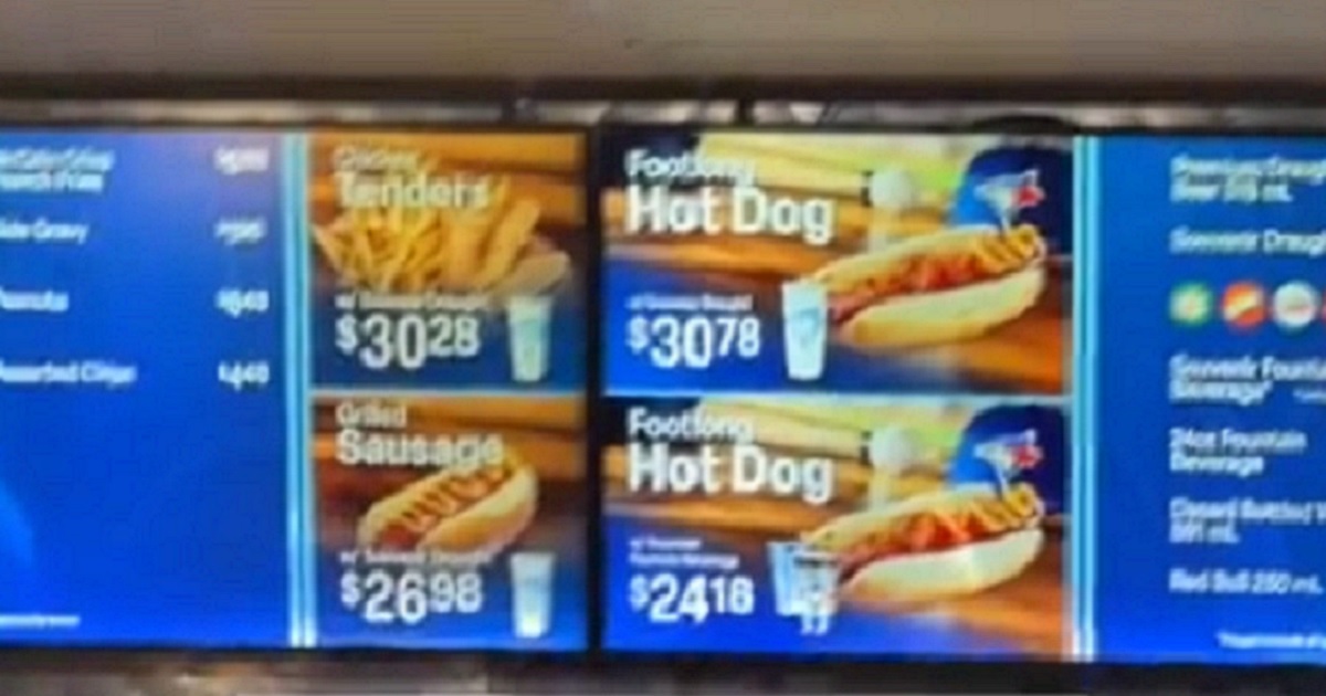 Concession stand prices show a hot dog and beer combo going for abotu $30 in Canadian currency.