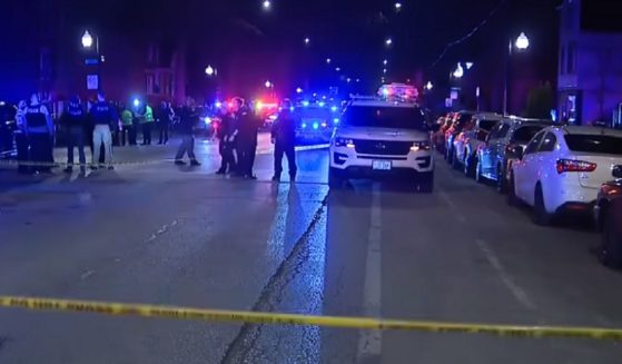 Police on the scene of a shooting in Chicago Saturday night that left an 8-year-old girl dead.