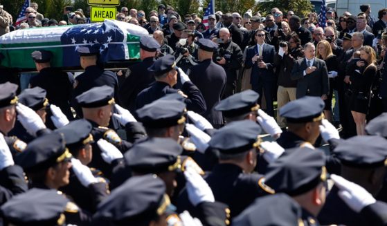 Pallbearers carry the casket of New York City police Officer Jonathan Diller on Saturday at St. Rose of Lima Church in Massapequa, New York.