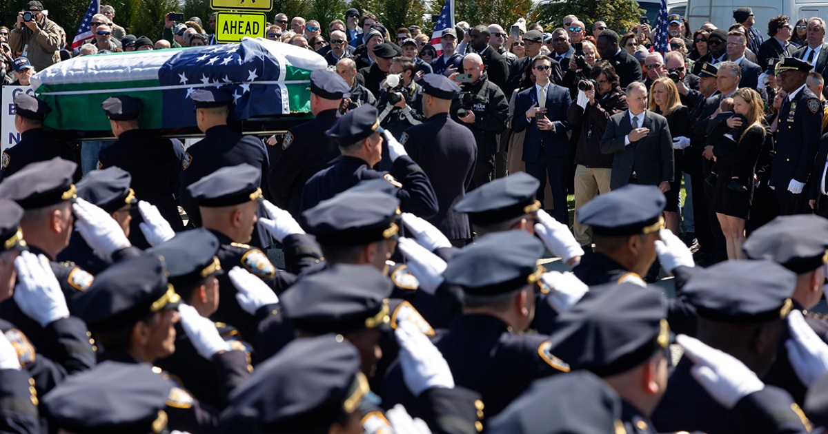 Pallbearers carry the casket of New York City police Officer Jonathan Diller on Saturday at St. Rose of Lima Church in Massapequa, New York.