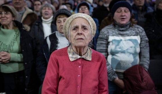 Local residents attend a Sunday service before receiving food aid at a Pentecostal church on Feb 19, 2023 in Kramatorsk, Ukraine.