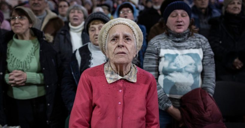 Local residents attend a Sunday service before receiving food aid at a Pentecostal church on Feb 19, 2023 in Kramatorsk, Ukraine.