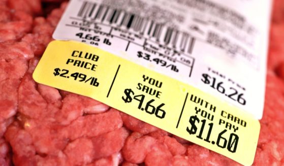 This picture shows a price tag on a large package of raw ground beef.