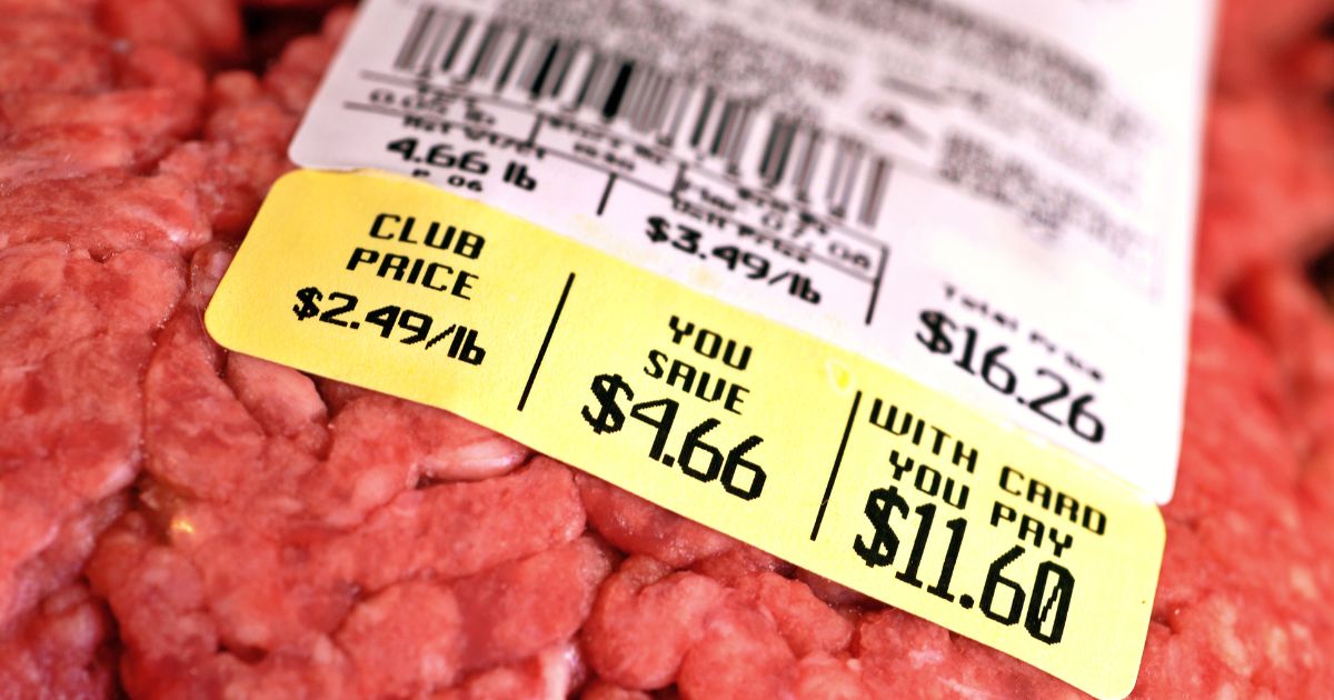 This picture shows a price tag on a large package of raw ground beef.