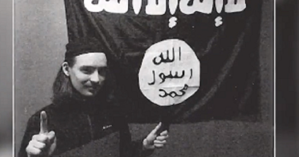 Alexander Scott Mercurio, 18, is pictured before a flag of the Islamic State group in a still from a CNN news cast about his arrest.