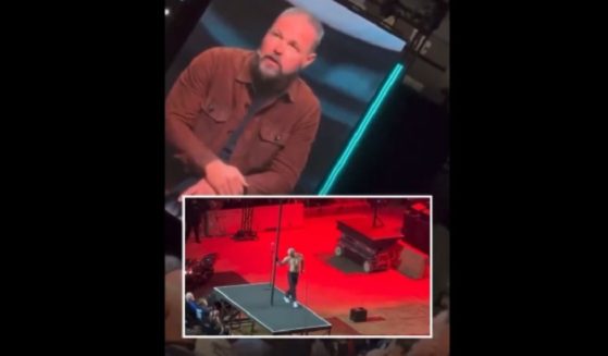 Pastor Mark Driscoll on the stage of the Stronger Men's Conference, with an inset of the conference opening act.