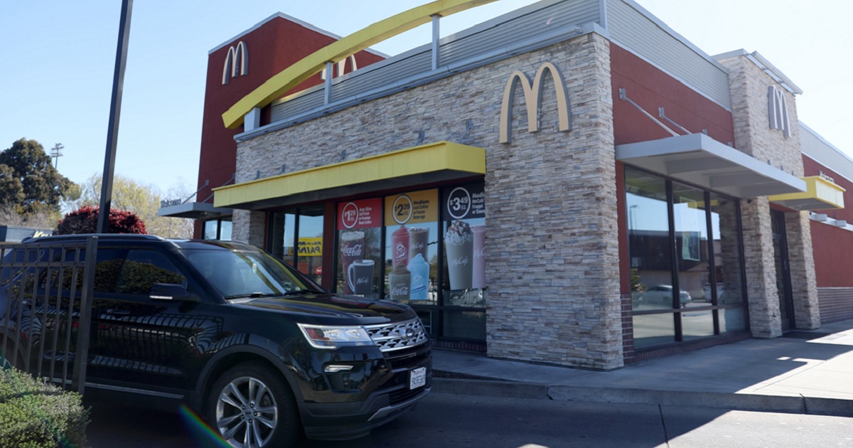 An SUV goes through the drive-thru at a McDonald's restaurant in San Pablo, California, in an April 2023 file photo.