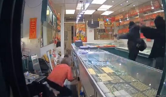 A still from security video captures a robbery in progress on Wednesday at an Oakland jewelry store.
