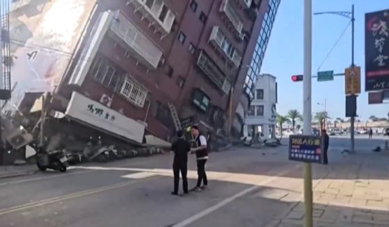 A building tilts to the point of collapse Wednesday in Hualien, Taiwan, after a powerful earthquake struck the country.