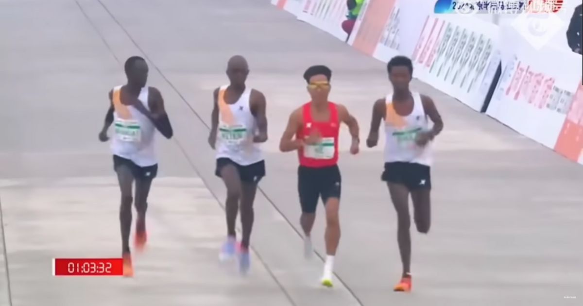 Three African runners appear to slow down near the finish line to allow China's He Jie to overtake them and win the Beijing half-marathon on April 14.