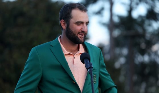 World No. 1 golfer Scottie Scheffler speaks to the crowd during the Green Jacket Ceremony after winning the 2024 Masters Tournament at Augusta National Golf Club on Sunday in Augusta, Georgia.