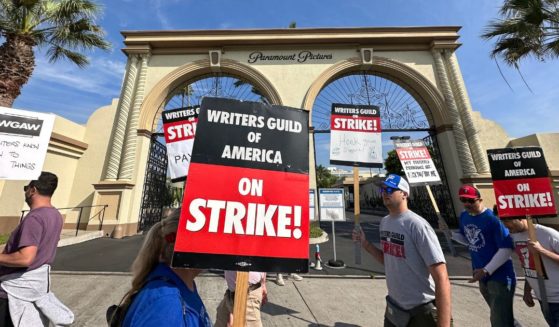 Picketers with the Writers Guild of America walk the line outside Paramount Studios in Los Angeles on Sept. 22.