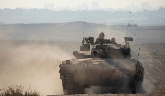 An Israeli tank moves along the border with the Gaza Strip on Sunday in southern Israel.
