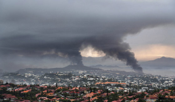 Smoke rises during armed clashes in Noumea, New Caledonia, on Wednesday. France has imposed a state of emergency in the French Pacific territory.