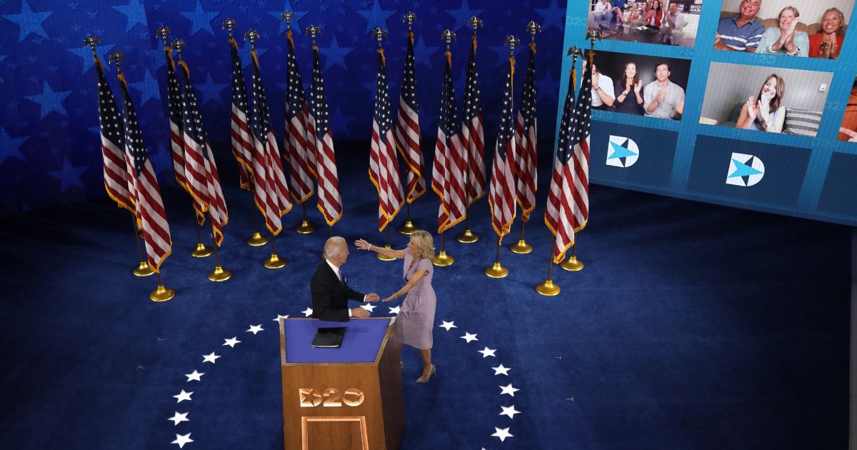 Then-Democratic presidential nominee Joe Biden is greeted by his wife, Jill Biden, after delivering his acceptance speech on the fourth night of the Democratic National Convention from the Chase Center in Wilmington, Delaware, on Aug. 20, 2020. The convention, which had been expected to draw 50,000 people to Milwaukee, took place virtually due to the coronavirus pandemic.
