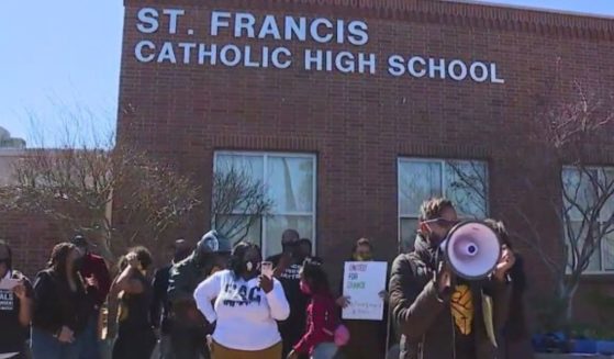 People protest over supposed "blackface" by students at St. Francis High School in Mountain View, California.