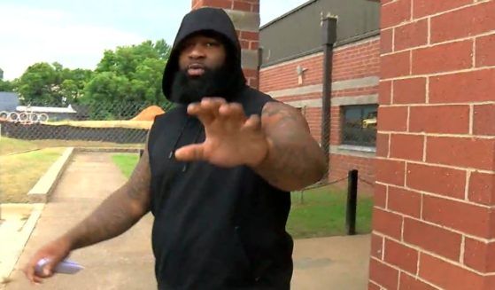 Kansas City Chiefs defensive lineman Isaiah Buggs reaches out toward a news camera after bonding out of jail.