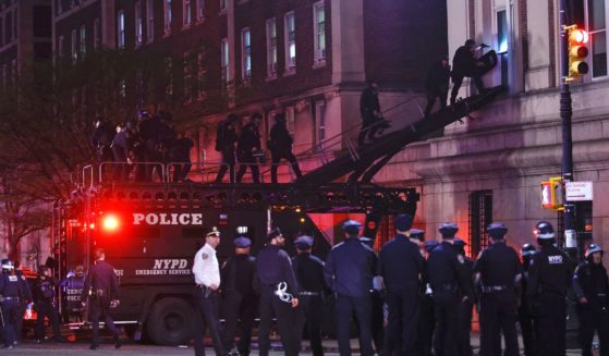 NYPD officers in riot gear enter Hamilton Hall at Columbia University, where pro-Palestinian students had barricaded set up an encampment, in New York City on Tuesday.