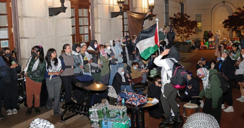 Anti-Israel protesters lock arms to block police from entering Hamilton Hall on the campus of Columbia University in New York City on Tuesday.