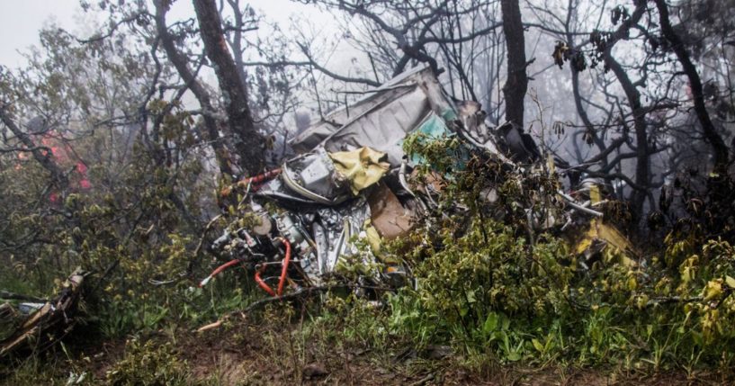 Wreckage is seen at the crash site of a helicopter transporting Iranian President Ebrahim Raisi and others in a fog-covered mountainous area of Varzaghan in northwestern Iran on Monday.