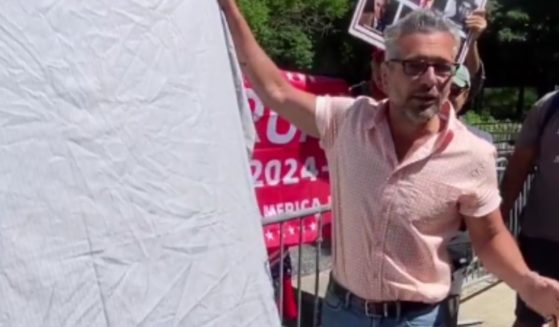 Following Robert De Niro's anti-Trump rant in Manhattan on Tuesday, conservative New York artist Scott LoBaido unveiled a piece of artwork across from the courthouse on Wednesday.