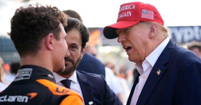 Donald Trump talking with driver Lando Norris of Britain after Norris won the Miami Formula One Grand Prix