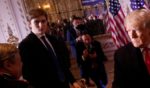 Barron Trump watches as his father greets people at Mar-a-Lago
