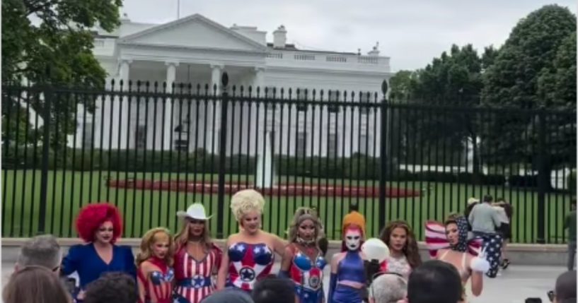 A group of eight drag queens from "Ru Paul's Drag Race All Stars" pose outside the White House in Washington, D.C., on Monday.
