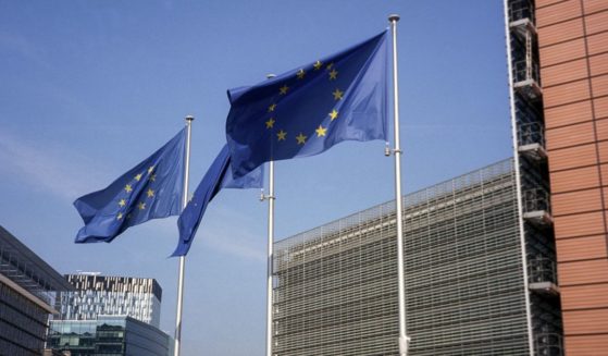 European Union flags fly in front of the EU Commission headquarters in Brussels on May 10.