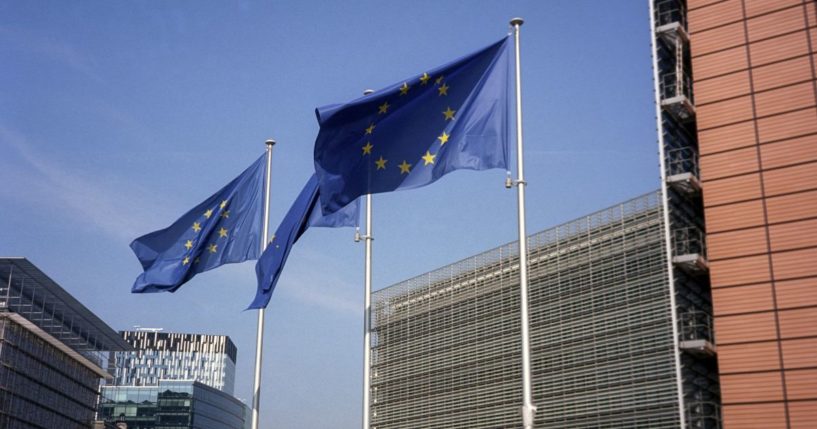 European Union flags fly in front of the EU Commission headquarters in Brussels on May 10.