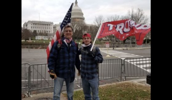 David Homol, left, and Dillon Homol, right, stand near the Capitol in Washington on Jan. 6, 2021.