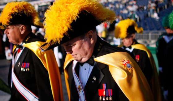 Members of the Knights of Columbus arrive before Pope Benedict XVI celebrates Mass at Nationals Park in Washington on April 17, 2008.