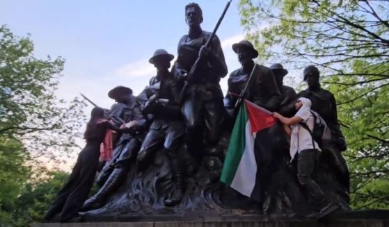 Anti-Israel protesters deface the 107th Infantry Memorial in New York's Central Park on Monday.
