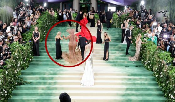 Workers at the Met Gala had to help several celebrities - including Lizzo, circled - up the stairs at The Metropolitan Museum of Art in New York City on Monday because their outfits did not allow them to walk upstairs on their own.