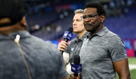 NFL Network personality Michael Irvin broadcasts from the field during the NFL Combine at the Lucas Oil Stadium on March 2, 2024 in Indianapolis, Indiana.