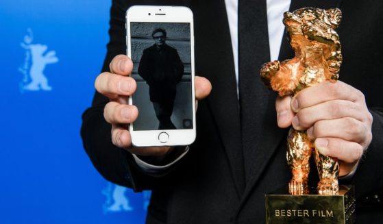An image of Iranian director Mohammad Rasoulof, winner of the Golden Bear for Best Film for the film "There Is No Evil," is shown next to his award at the award winners news conference during the 70th Berlinale International Film Festival Berlin in Berlin, Germany, on Feb. 29, 2020.
