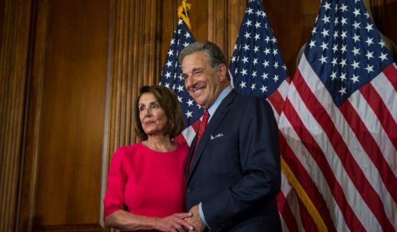 House Speaker Nancy Pelosi posing for pictures with her husband, Paul Pelosi, on Capitol Hill in 2019.